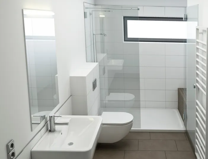 Kleines, aber helles Badezimmer mit Waschbecken, WC und Dusche. 