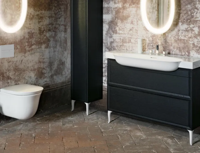 Ein stilvolles Badezimmer mit einer schwebenden Toilette und einem modernen schwarzen Waschtisch mit weißem Aufsatzwaschbecken.